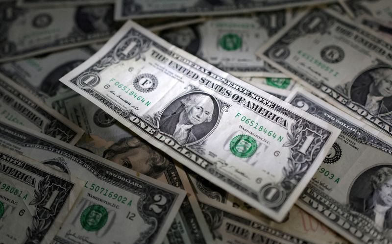 Marketmind: Dollar flexes into Fed week, serene returns